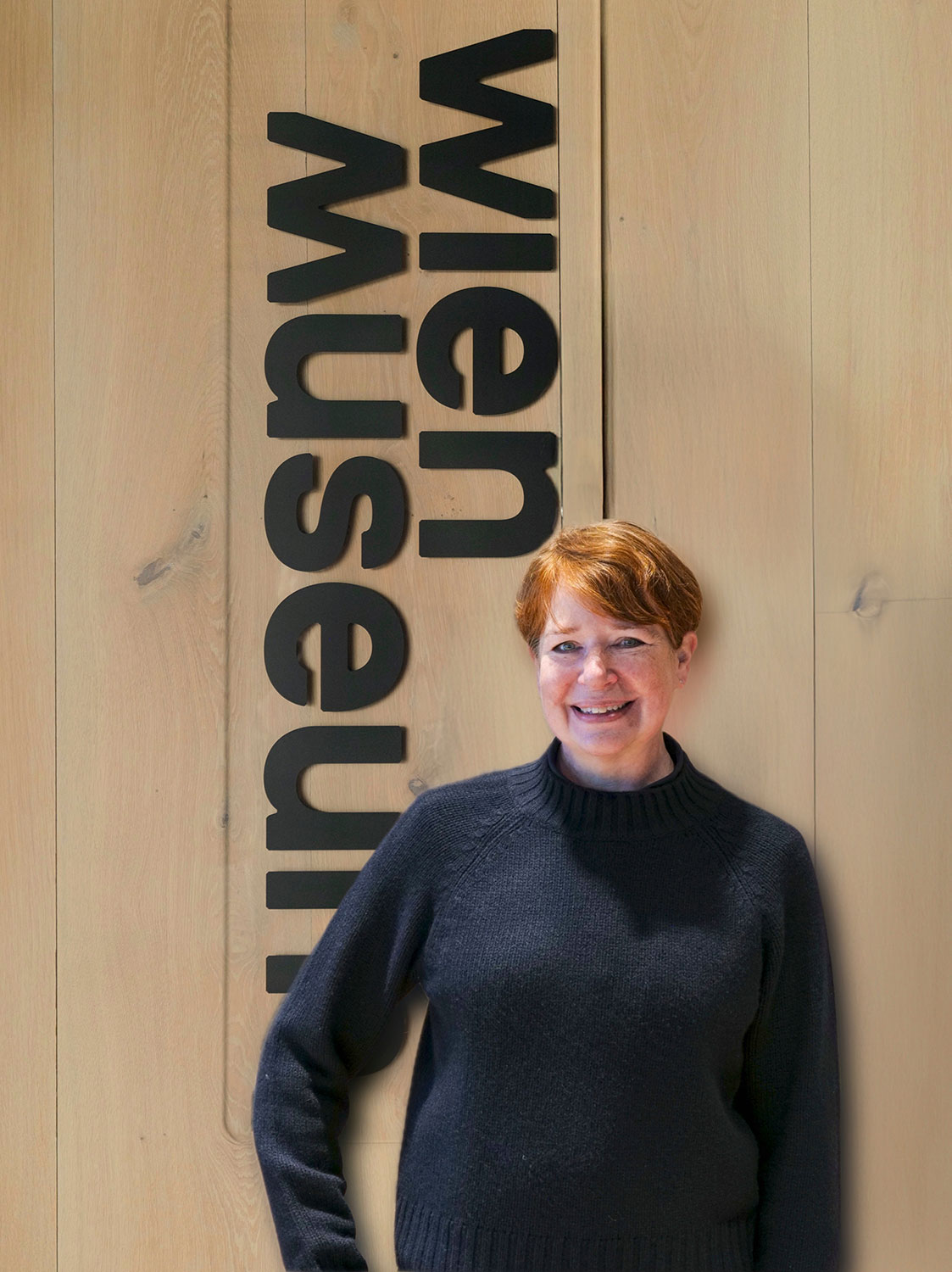 Porträt vor einem Wien Museum Logo 