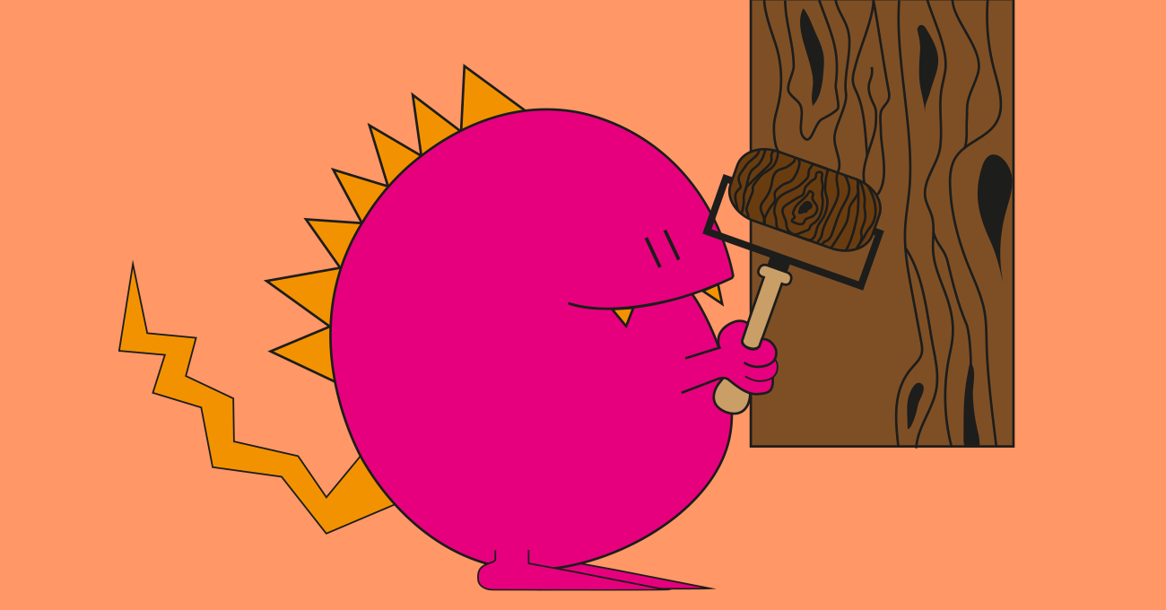Rundes pinkes Monster vor einem Holz mit einer Walze