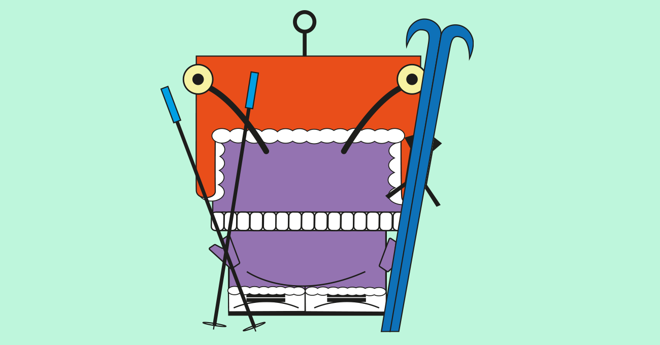 Eckiges oranges Monster in einem Skianzug mit Ski und Skistöcken in den Händen