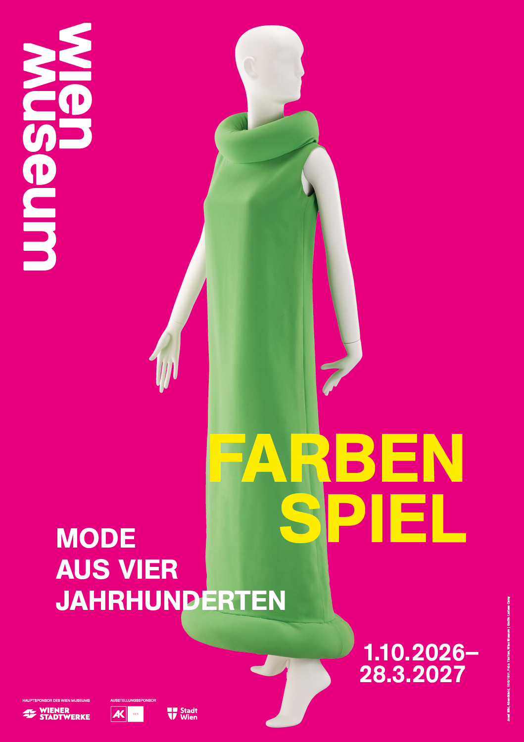 Grünes Kleid vor pinkem Hintergrund 